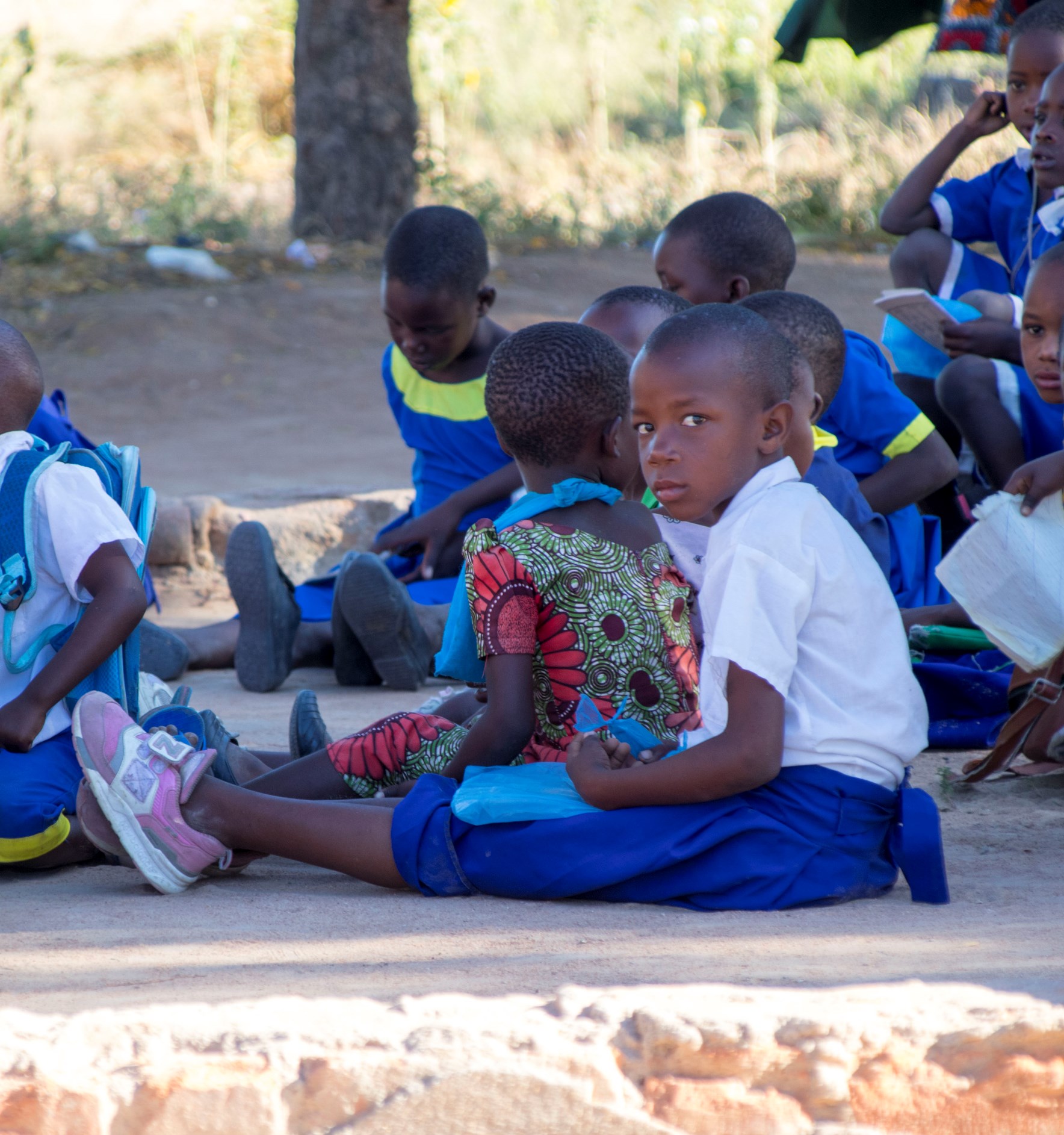 Primary School Pupils Be Taught while siting on the floor after their clasroom collapsed